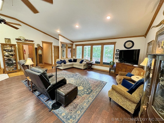 living room with hardwood / wood-style flooring, ornamental molding, lofted ceiling, and ceiling fan