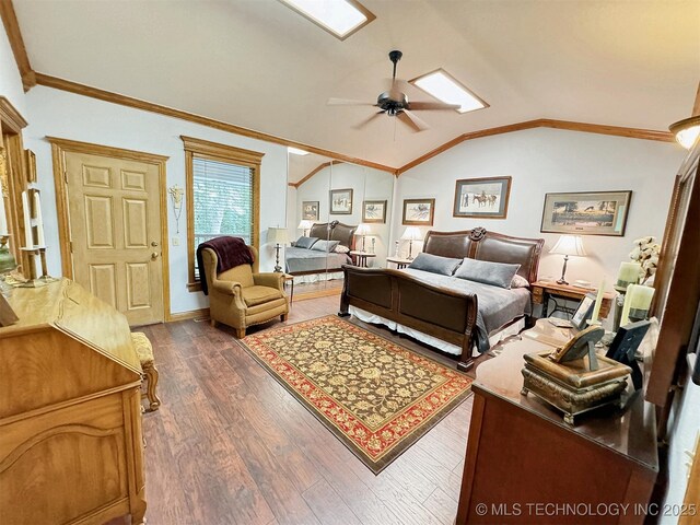 bedroom featuring crown molding, lofted ceiling, dark hardwood / wood-style floors, and ceiling fan