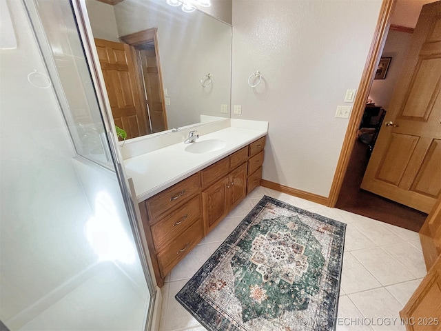 bathroom with tile patterned floors, an enclosed shower, and vanity