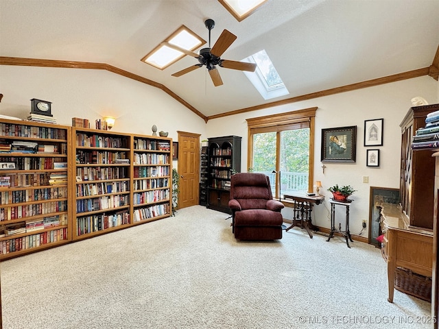 living area with light colored carpet, lofted ceiling with skylight, and ceiling fan