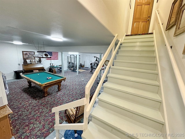 game room featuring carpet, pool table, and a textured ceiling