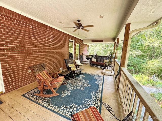 wooden terrace featuring ceiling fan