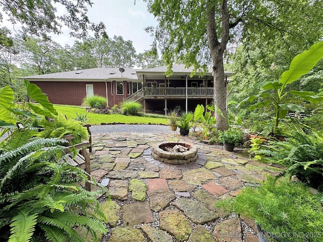 view of patio / terrace featuring a fire pit