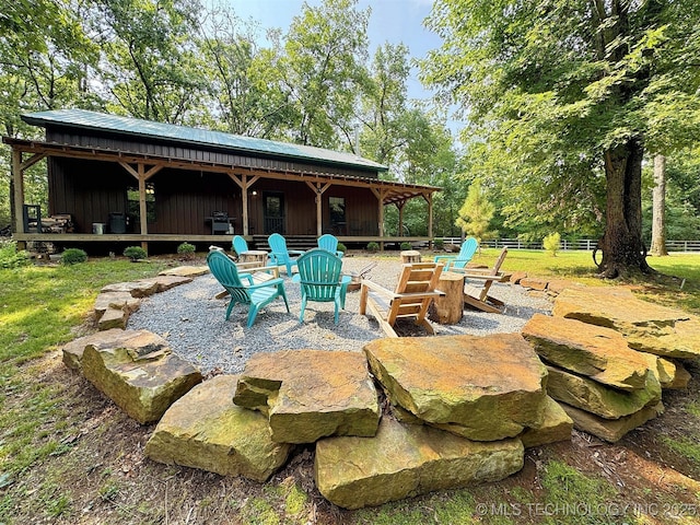 view of patio featuring an outdoor fire pit