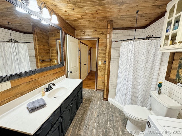 bathroom featuring wooden walls, vanity, wood-type flooring, wooden ceiling, and toilet