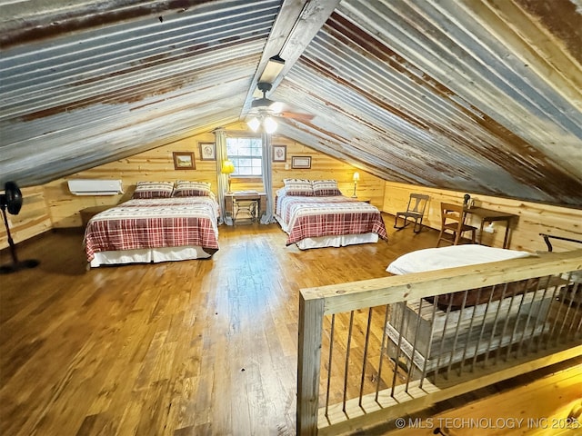 bedroom with lofted ceiling, hardwood / wood-style floors, wooden ceiling, and a wall mounted AC