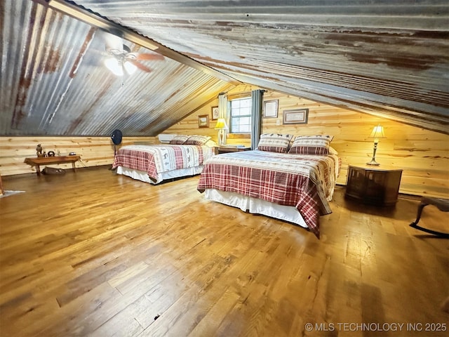 bedroom featuring wood ceiling, ceiling fan, vaulted ceiling, and hardwood / wood-style floors