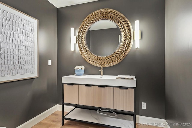 bathroom with sink and hardwood / wood-style flooring