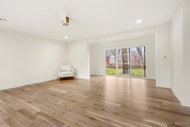 unfurnished room with ceiling fan and light hardwood / wood-style floors