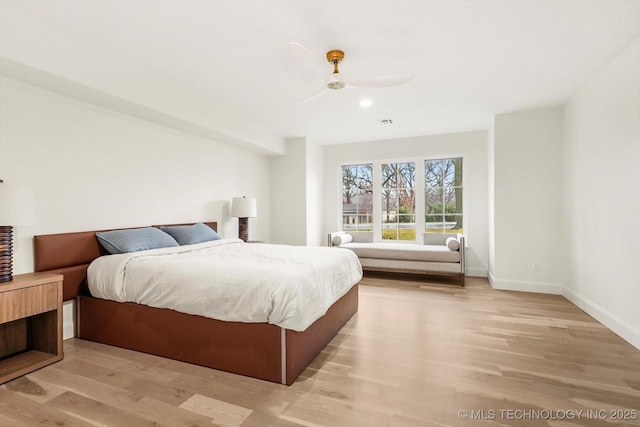 bedroom featuring light hardwood / wood-style flooring and ceiling fan