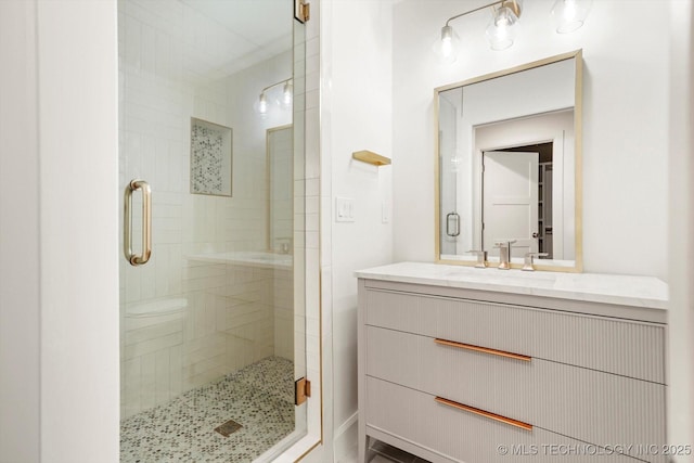 bathroom with vanity and walk in shower