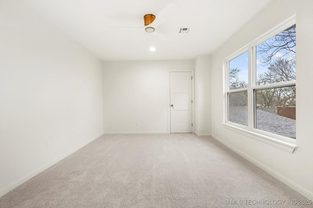 empty room featuring light colored carpet