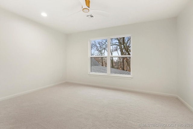 carpeted empty room with ceiling fan