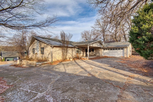 ranch-style home with a garage