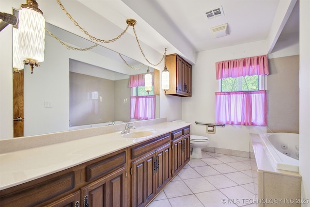 bathroom with vanity, a relaxing tiled tub, tile patterned floors, and toilet