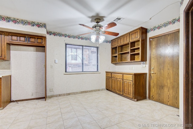 kitchen with decorative backsplash and ceiling fan