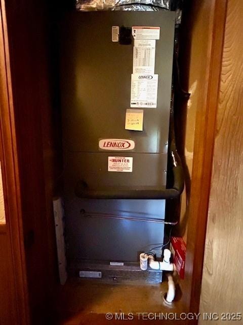 utility room with heating unit