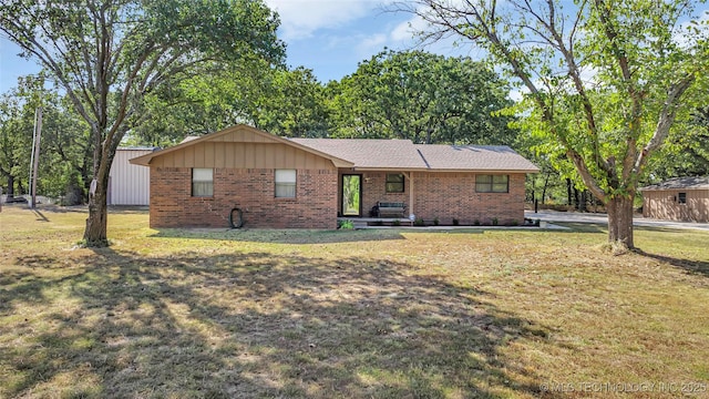 ranch-style home with a front lawn