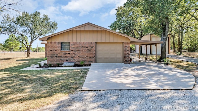 view of front of house with a garage and a front lawn