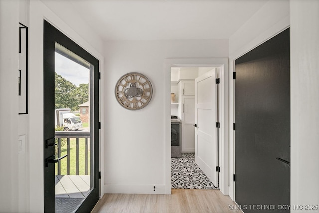 hall with light hardwood / wood-style floors