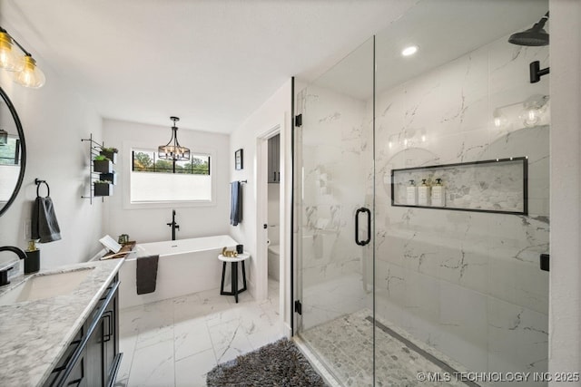 full bathroom featuring independent shower and bath, vanity, and toilet