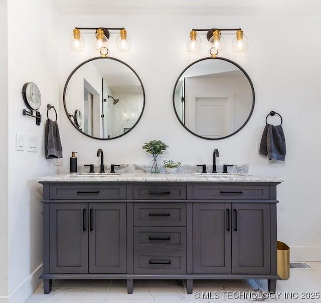 bathroom with tile patterned flooring and vanity