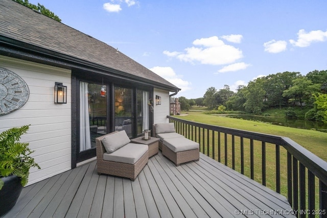 wooden terrace featuring a yard