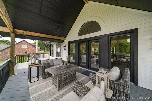 deck with outdoor lounge area and french doors