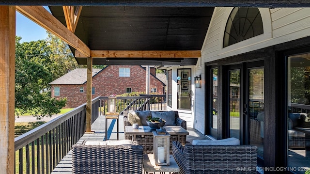 deck with an outdoor hangout area