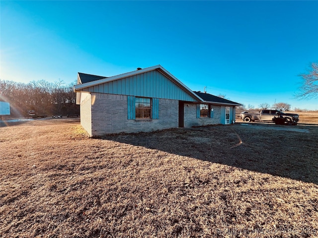 view of property exterior with a lawn