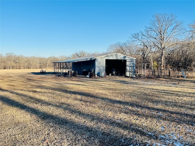 view of outdoor structure featuring a lawn