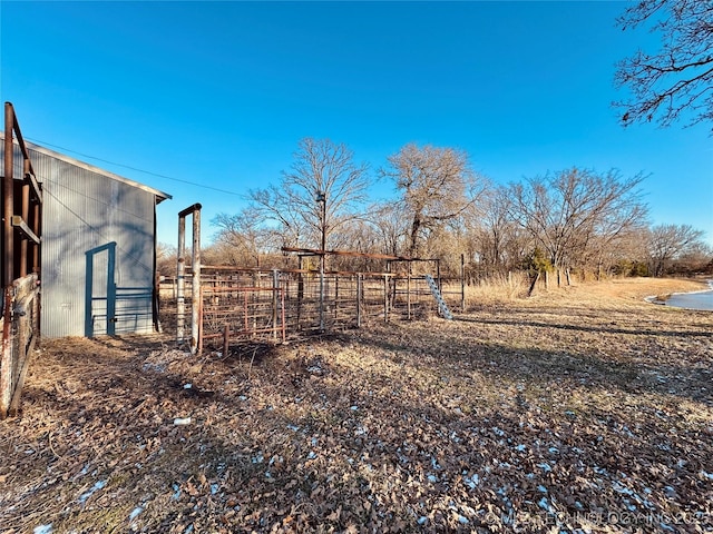 view of yard featuring an outbuilding and a rural view