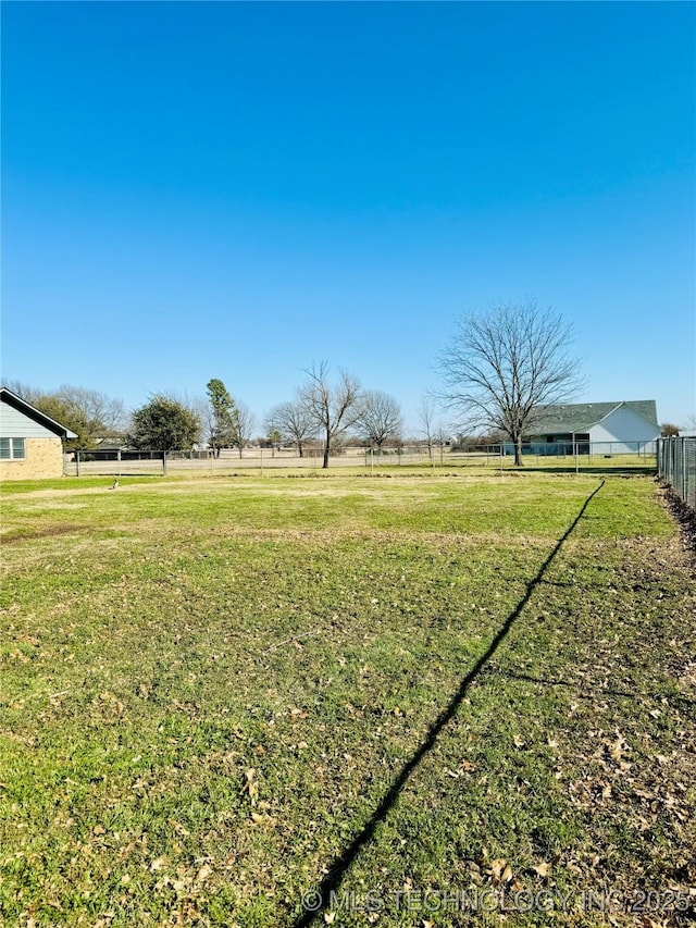 view of yard with a rural view