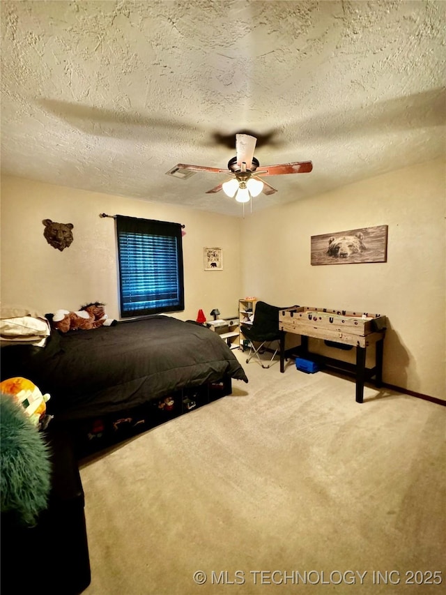 bedroom with carpet flooring, a textured ceiling, and ceiling fan