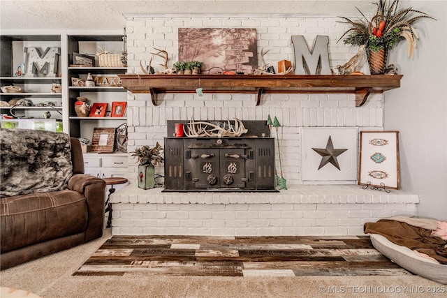 living area with a textured ceiling