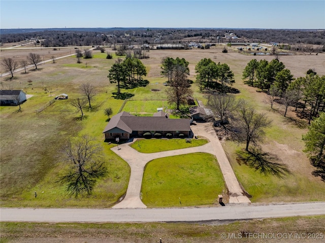 birds eye view of property with a rural view