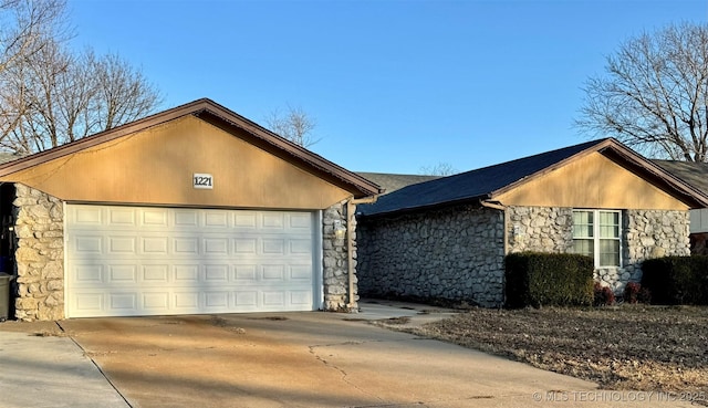 ranch-style home with a garage