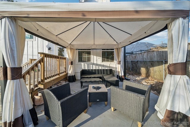 view of patio with a gazebo and an outdoor hangout area