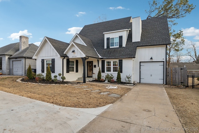 2508 E 16th St, Tulsa, OK 74104 - modern farmhouse with board and batten siding, driveway, a garage, roof with shingles, and brick siding