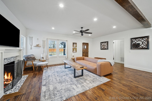 2508 E 16th St, Tulsa, OK 74104 - living area with a fireplace, dark wood-style flooring, a ceiling fan, recessed lighting, and baseboards