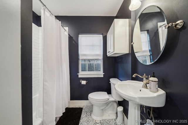 bathroom with tile patterned floors and toilet