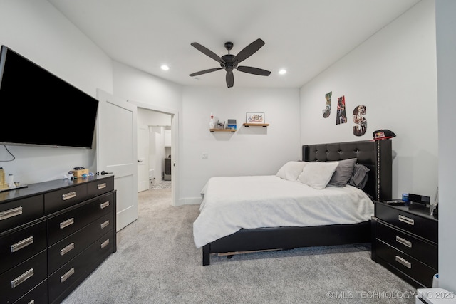 bedroom featuring light colored carpet and ceiling fan