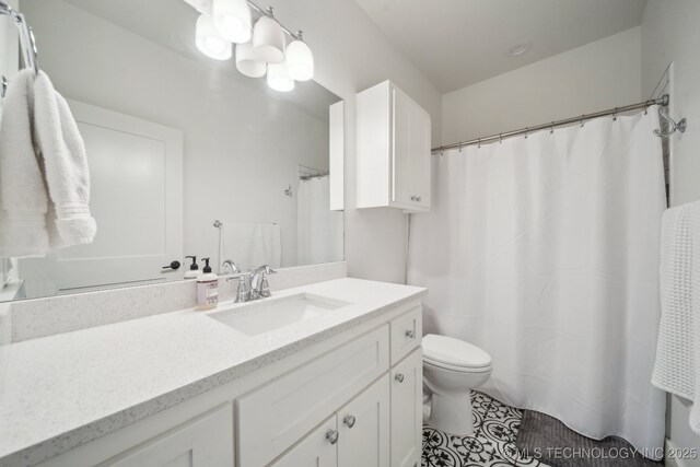 2508 E 16th St, Tulsa, OK 74104 - full bathroom featuring toilet, vanity, and tile patterned floors