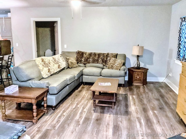 living area featuring wood finished floors and baseboards