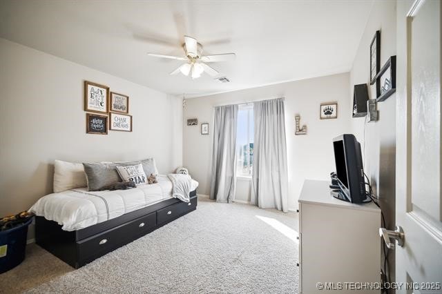 bedroom featuring ceiling fan and carpet flooring