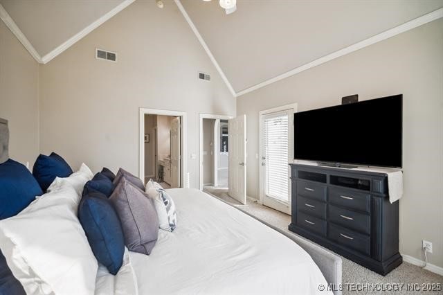 bedroom with light carpet, connected bathroom, ornamental molding, and high vaulted ceiling