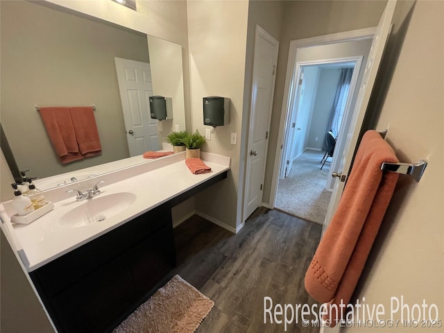 bathroom with wood-type flooring and vanity