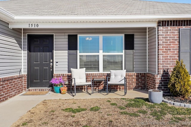 property entrance with covered porch