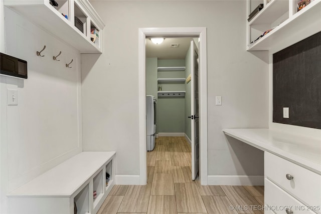 mudroom featuring built in desk