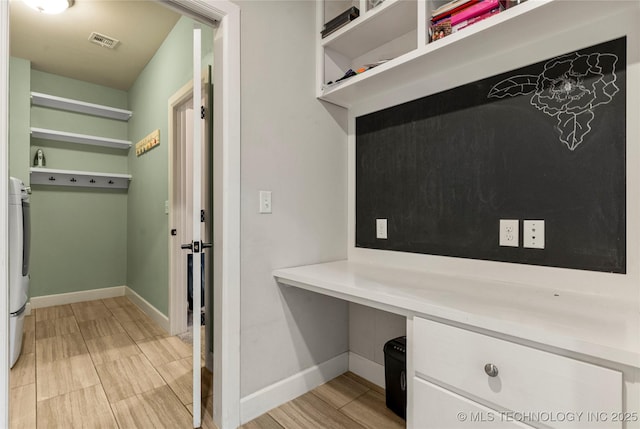 mudroom with built in desk